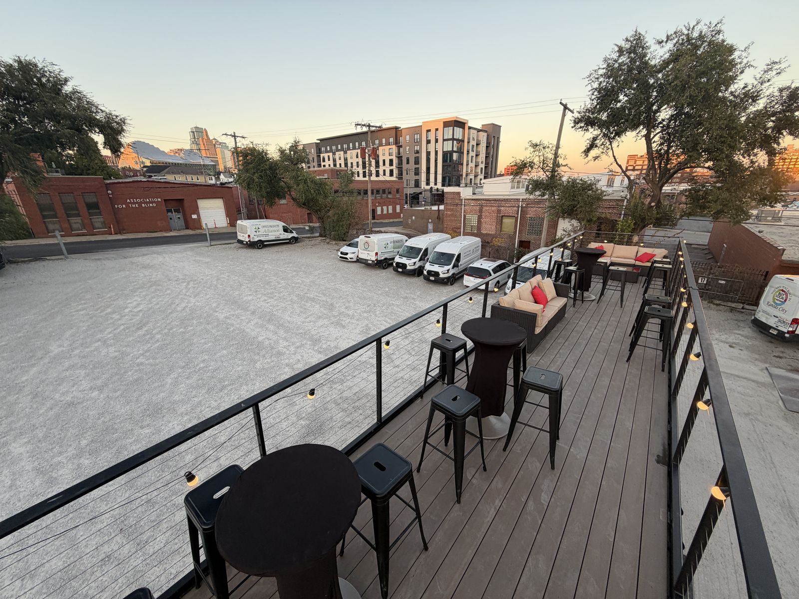 Daytime view down the length of the lounge at Game Show Studio, with the rooftop deck and open bay