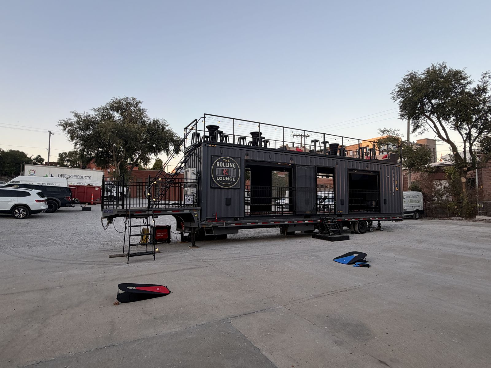 The Rolling Lounge parked beside the Game Show Studio building in daylight