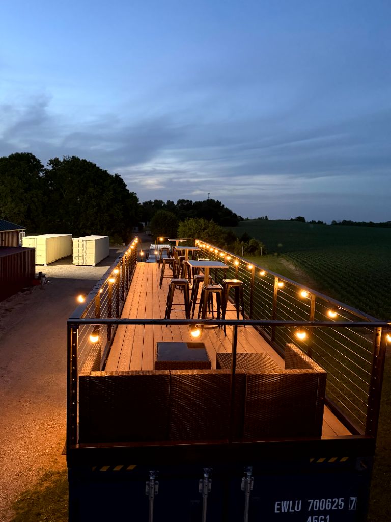 Rooftop deck lounge seating at dusk